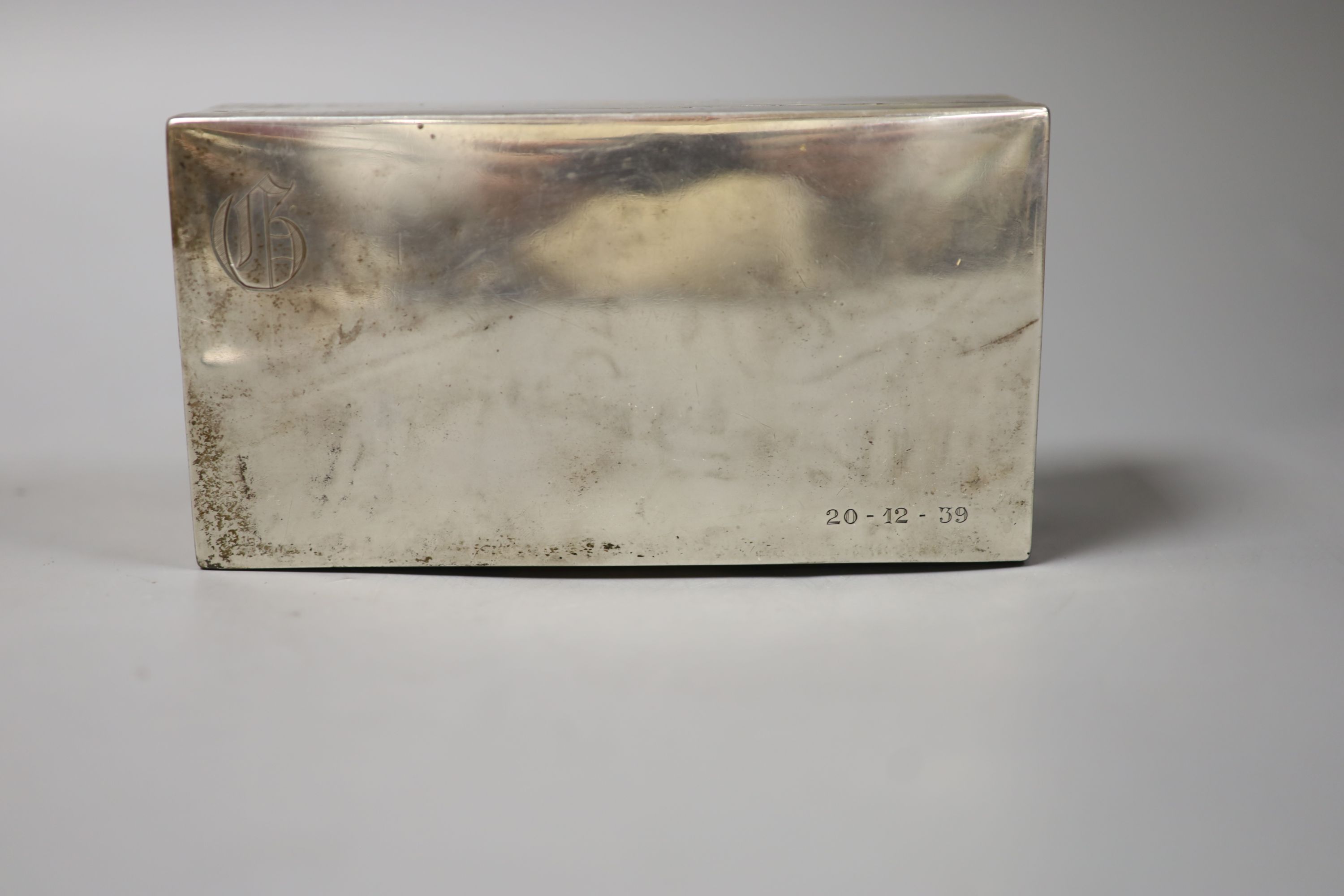 A continental white metal mounted rectangular cigarette box, stamped 'M Levy Sterling'